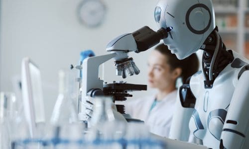 Scientist and robot working together in the lab