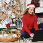 Woman sending e-mails on Christmas