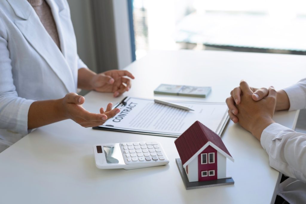 Real estate brokerage agent Offering for sale and contract agreement, home insurance concept. Making