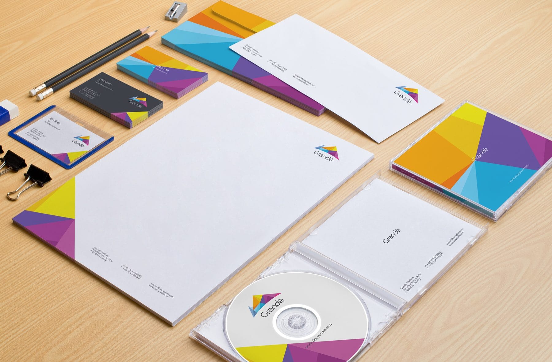 Printed business cards, letterhead and a CD sleeve in one brand color system